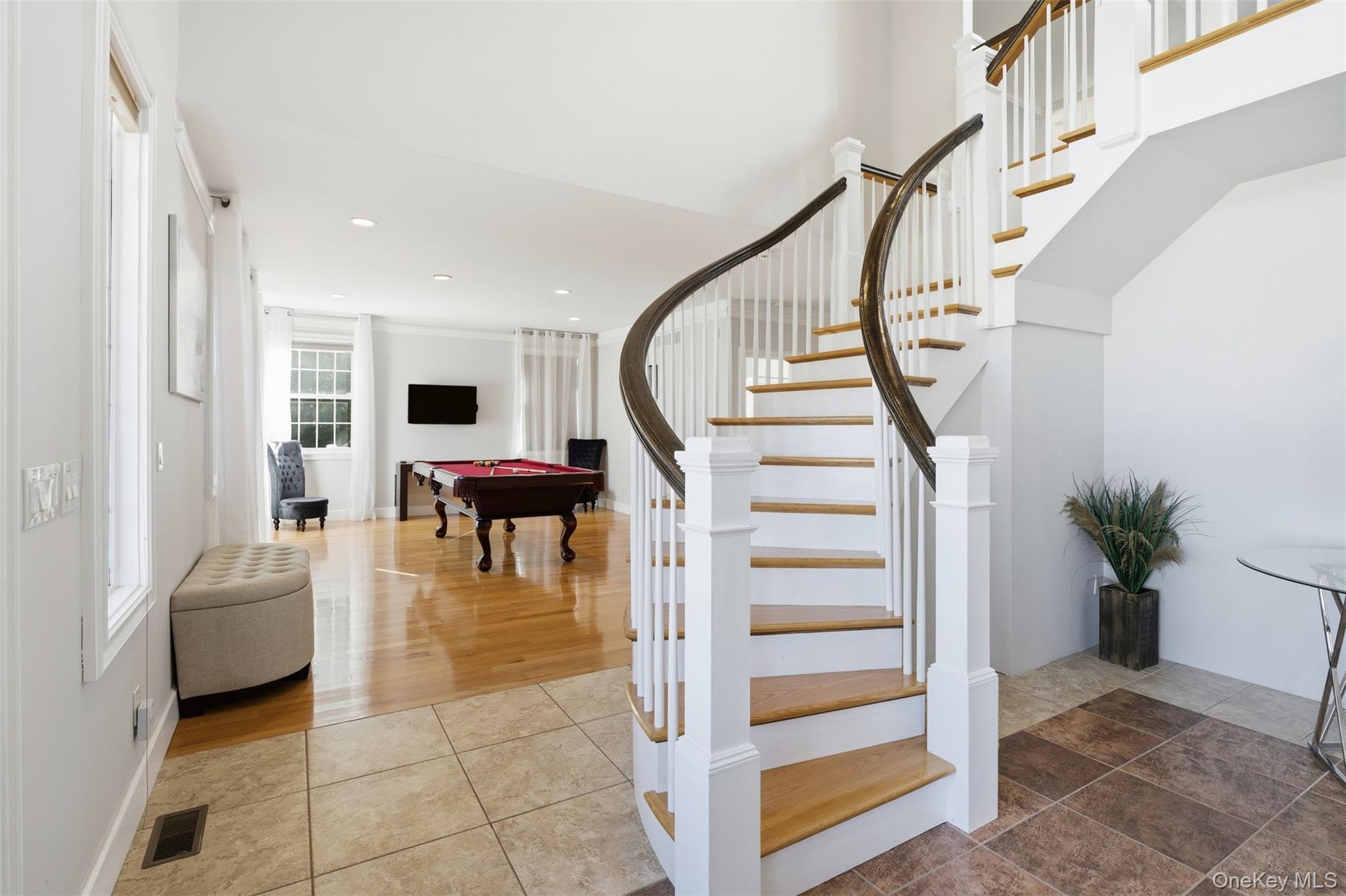 33 A Newtown Road Hampton Bays, NY 11946 - Photo 19 of 50 Stairway with billiards table, tile patterned floors, and recessed lighting
