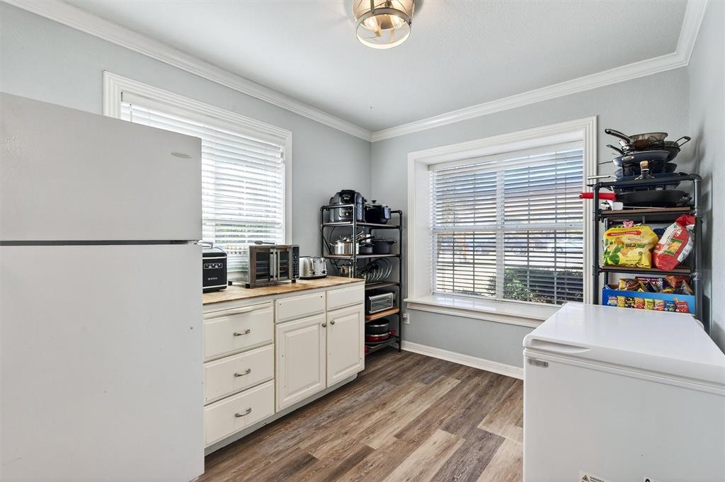 207 Gayle Circle Bells, TX 75414 - Photo 14 of 30 a kitchen with a refrigerator and a sink