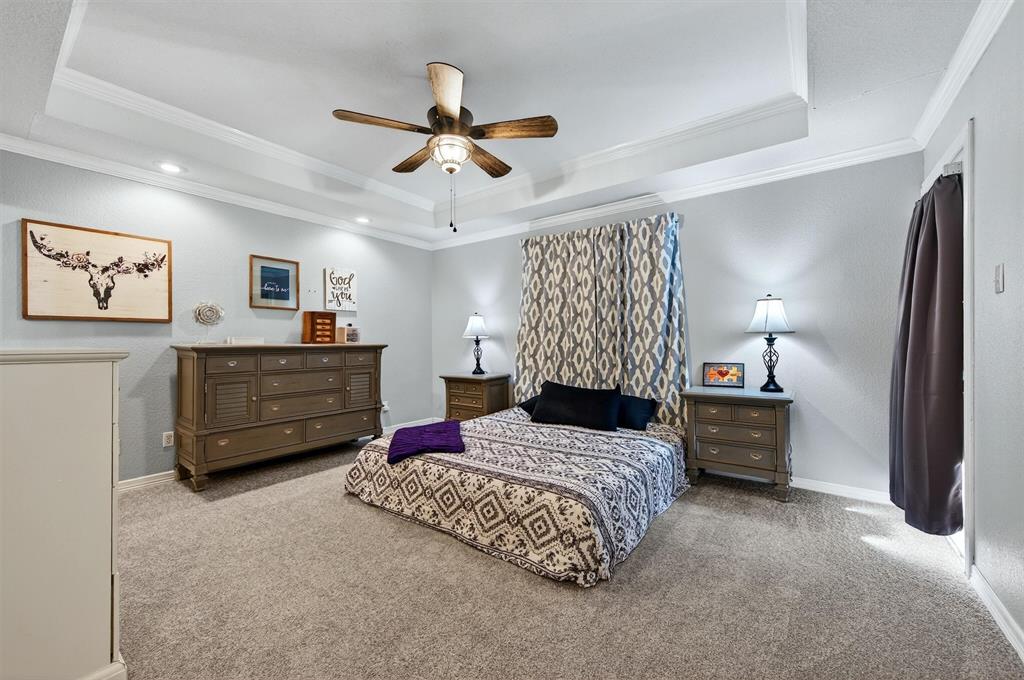 207 Gayle Circle Bells, TX 75414 - Photo 15 of 30 a bedroom with a bed dresser and furniture