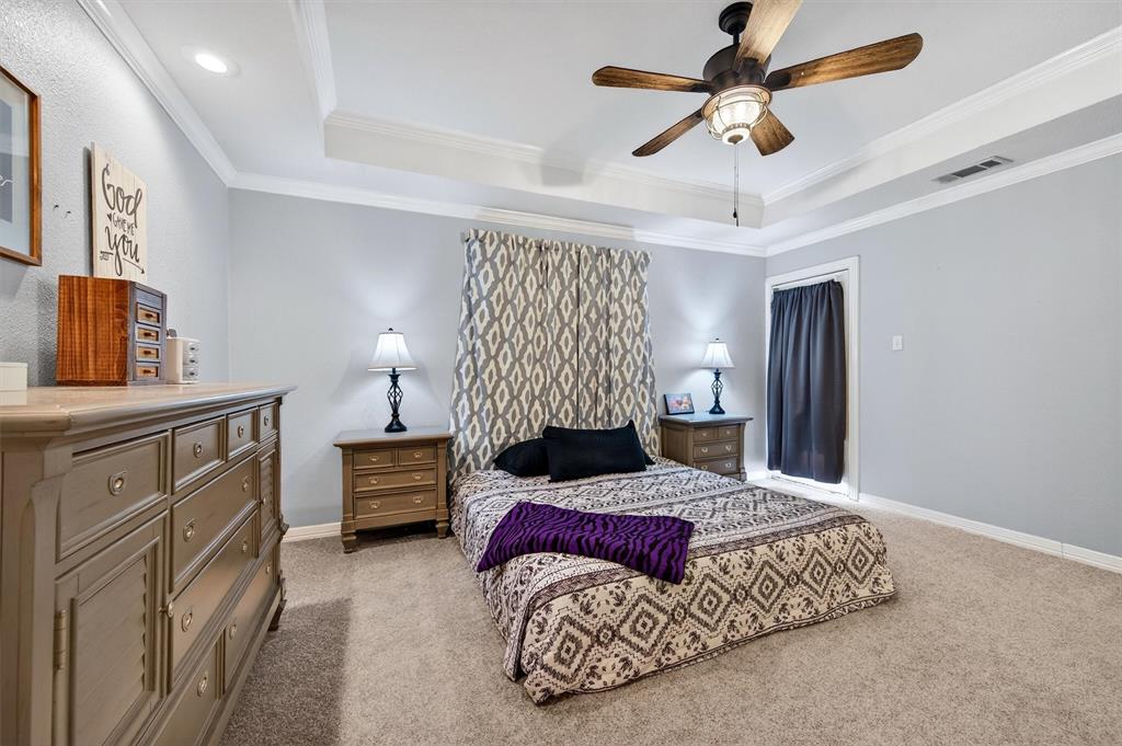 207 Gayle Circle Bells, TX 75414 - Photo 17 of 30 a bedroom with a bed dresser and a window