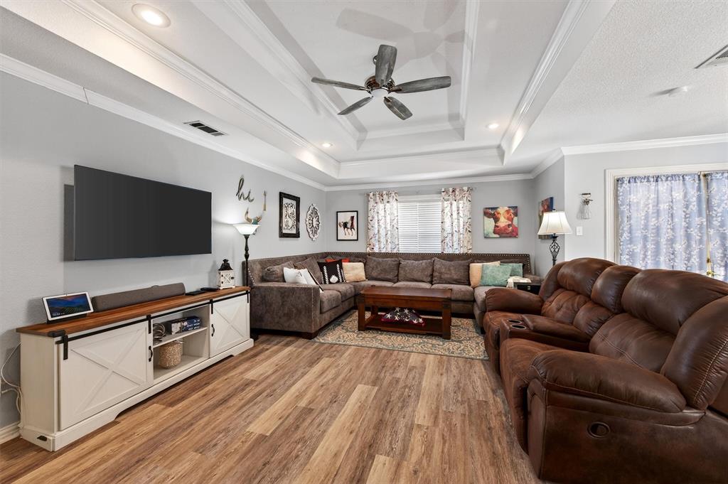 207 Gayle Circle Bells, TX 75414 - Photo 6 of 30 a living room with furniture and a flat screen tv