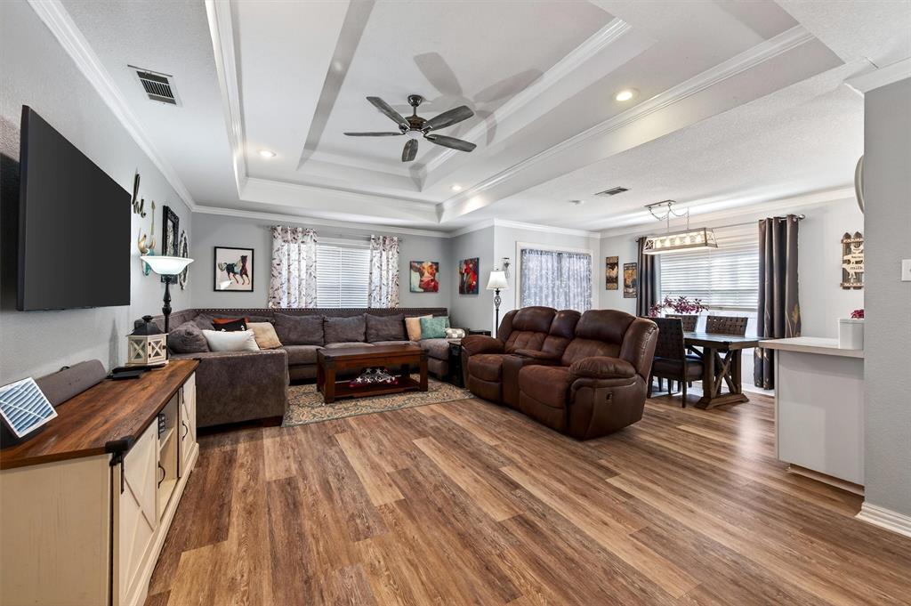 207 Gayle Circle Bells, TX 75414 - Photo 7 of 30 a living room with furniture and a flat screen tv