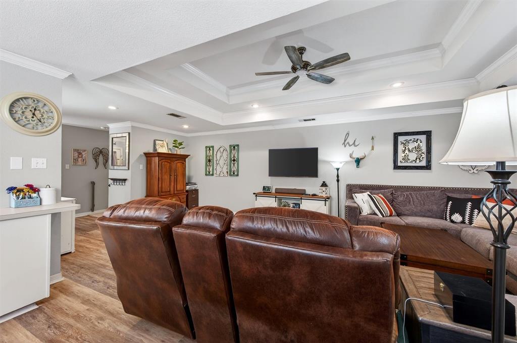 207 Gayle Circle Bells, TX 75414 - Photo 8 of 30 a living room with furniture and a flat screen tv