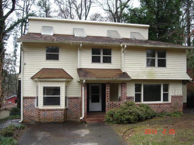 2853 Monterey Drive, Unit 6 Decatur, GA 30032 - Photo 1 of 1 a view of a house with a yard and large windows