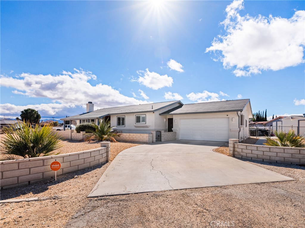 13860 Cree Road Apple Valley, CA 92307 - Photo 1 of 1 a view of a house with backyard and sitting area