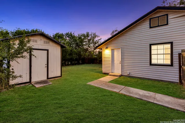 a backyard of a house with lots of green space