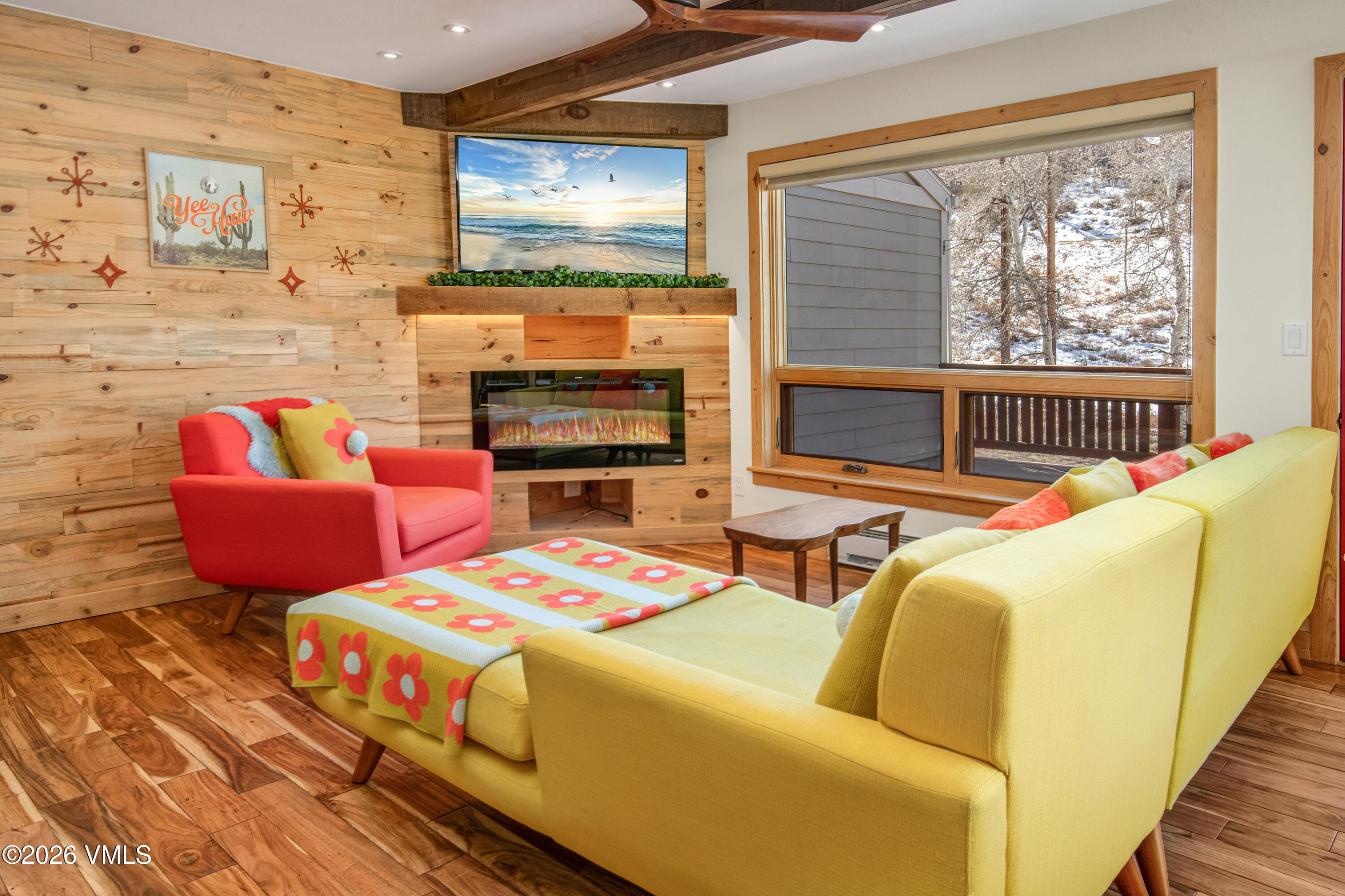 2355 Old Trail Road, Unit 3 Avon, CO 81620 - Photo 1 of 34 a living room with furniture a flat screen tv and a fireplace
