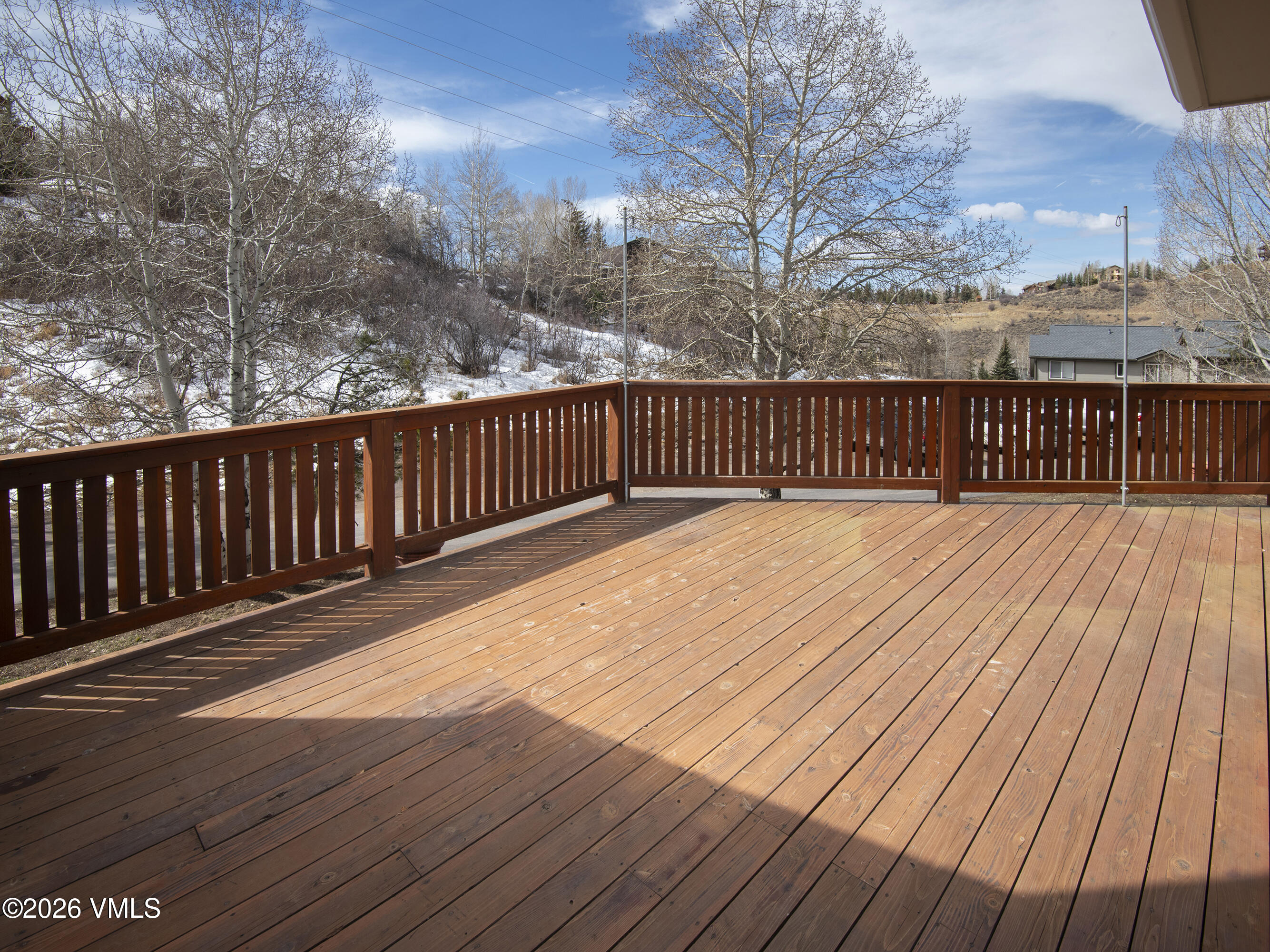 2355 Old Trail Road, Unit 3 Avon, CO 81620 - Photo 14 of 34 a balcony with wooden floor
