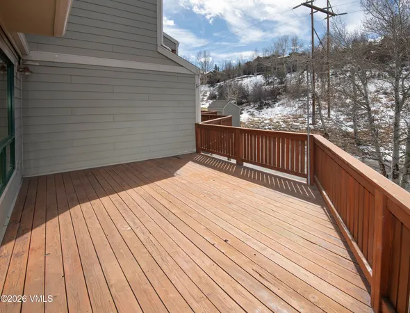 a balcony with wooden floor