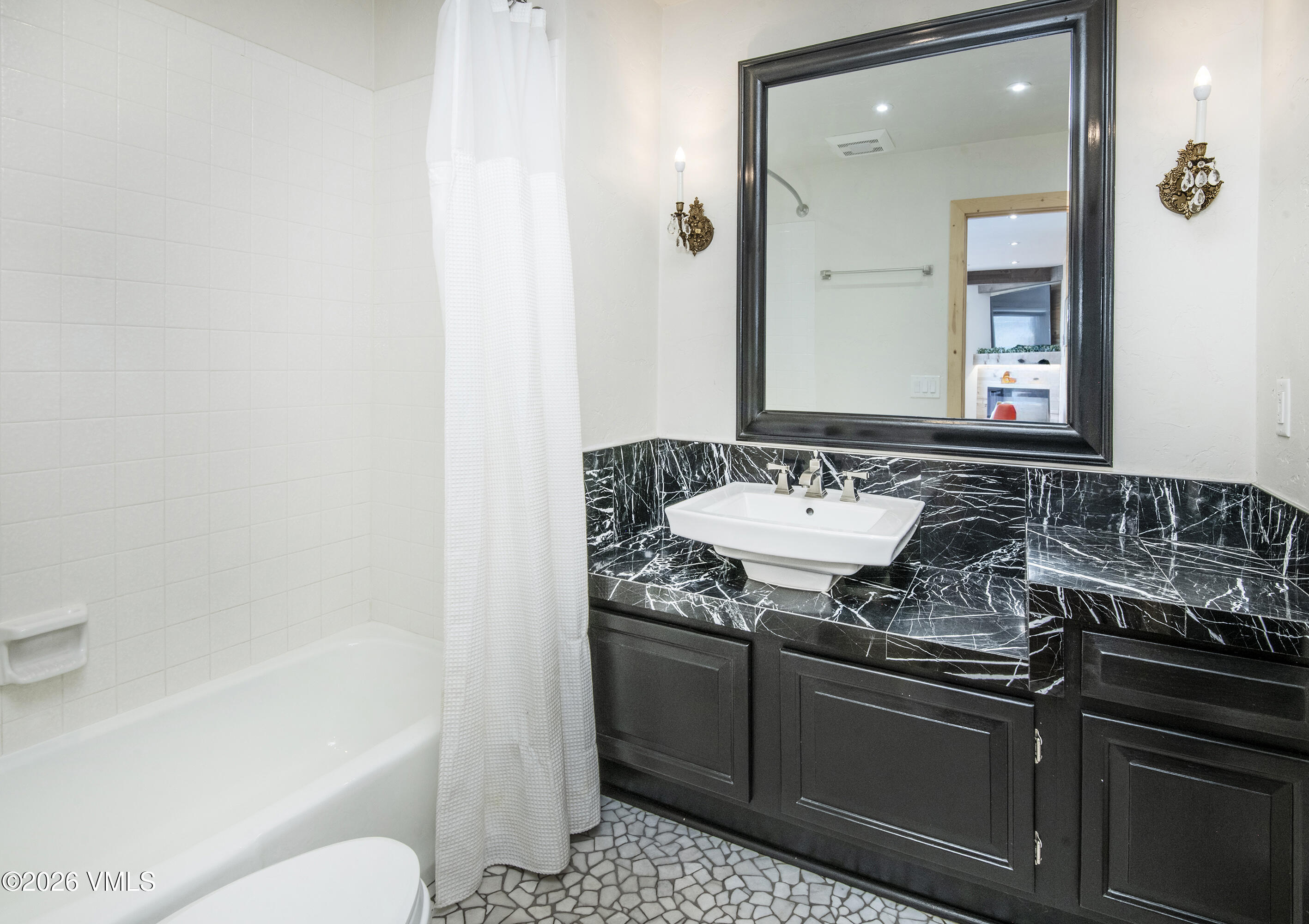 2355 Old Trail Road, Unit 3 Avon, CO 81620 - Photo 18 of 34 a bathroom with a sink and a mirror