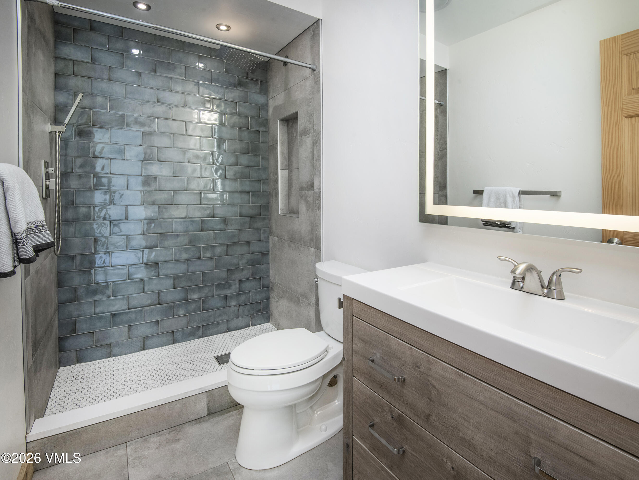 2355 Old Trail Road, Unit 3 Avon, CO 81620 - Photo 22 of 34 a bathroom with a sink a toilet and shower