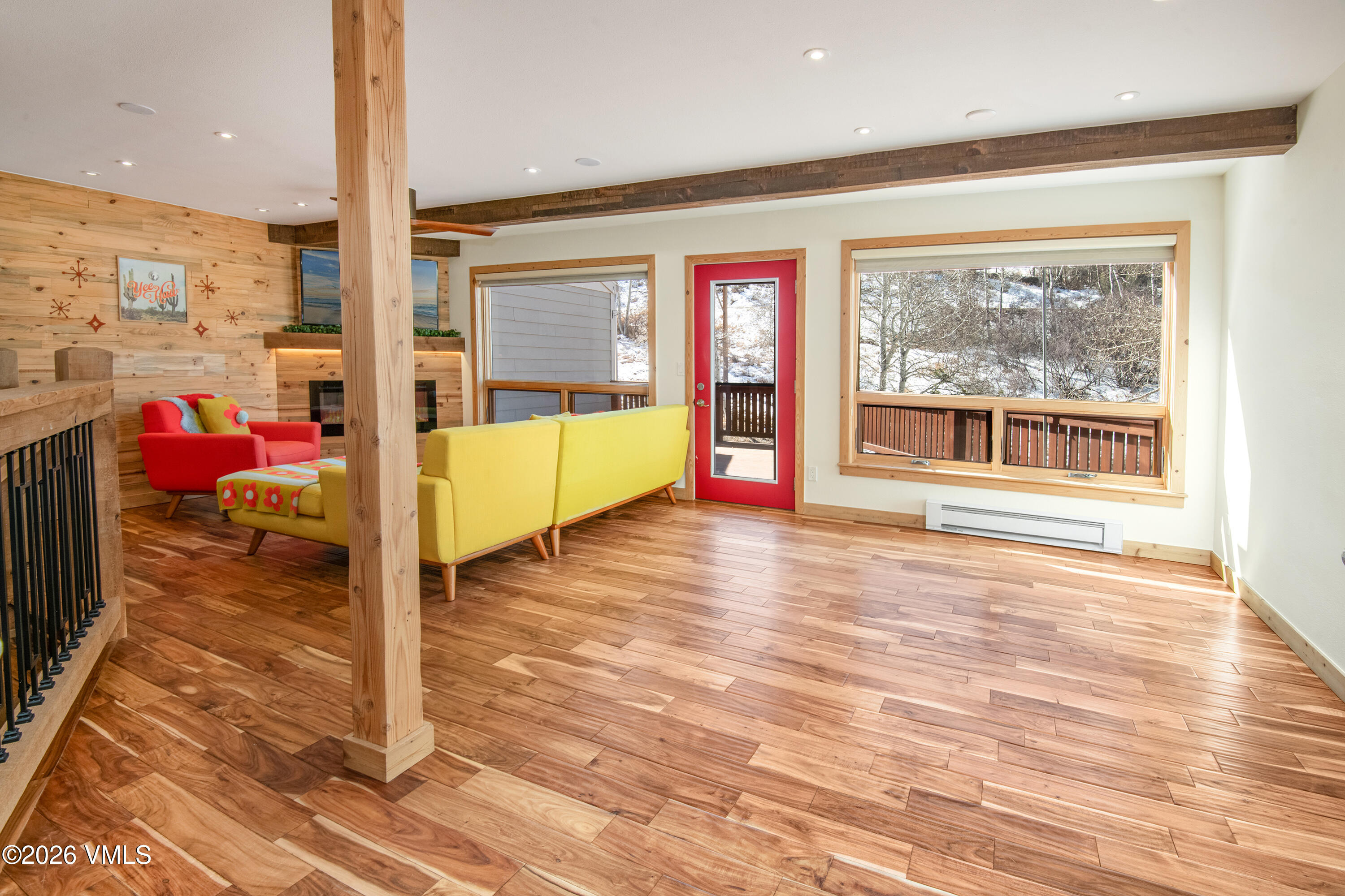2355 Old Trail Road, Unit 3 Avon, CO 81620 - Photo 5 of 34 a view of a room with wooden floor and a floor to ceiling window