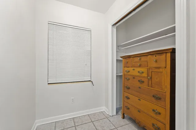 a view of walk in closet with cabinet
