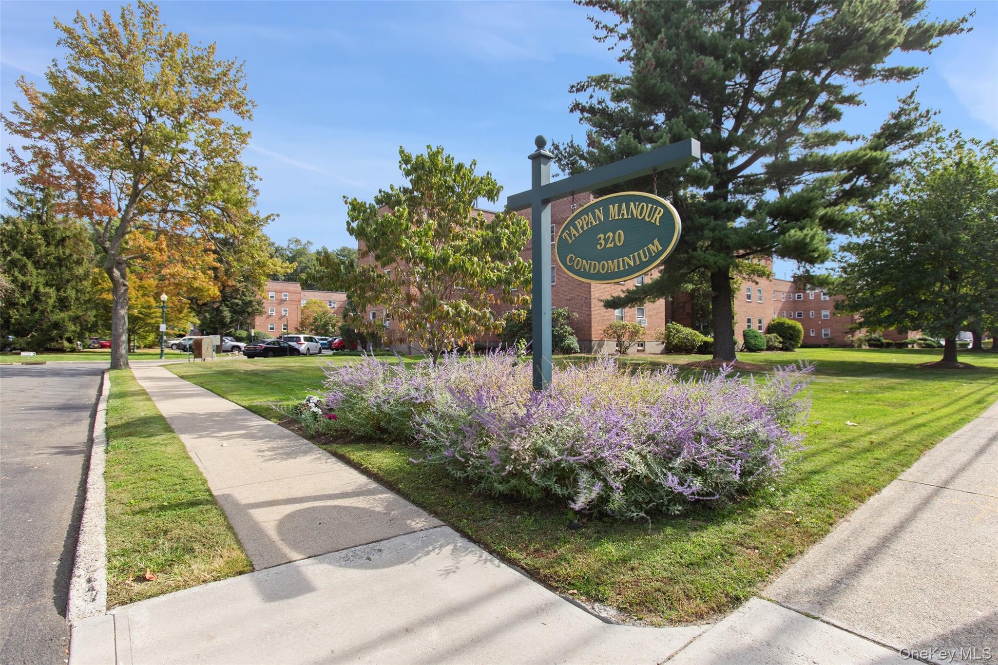 320 South Broadway, Unit R12 Tarrytown, NY 10591 - Photo 1 of 1 a view of a park with large trees