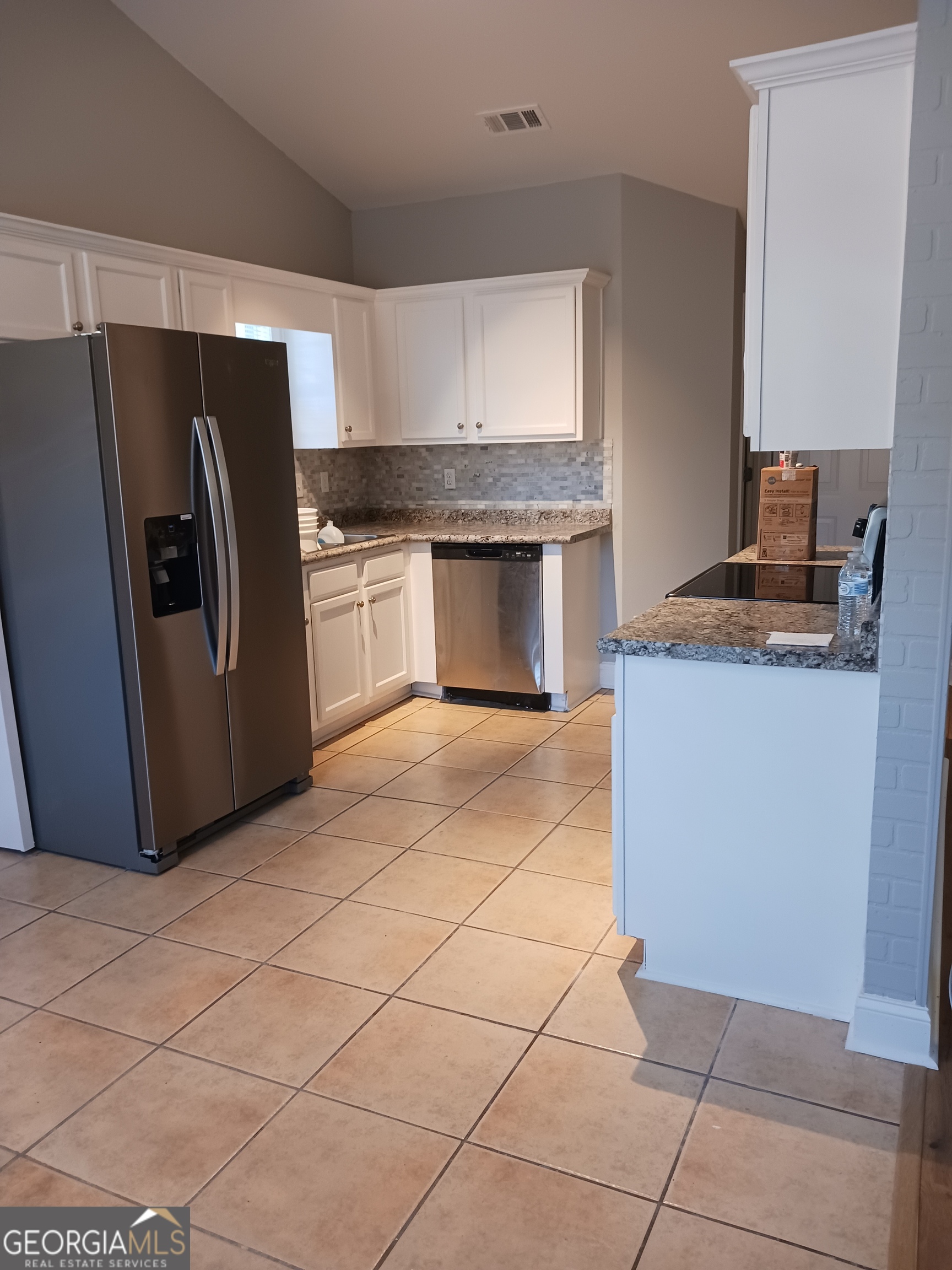 907 Downing Drive Bethlehem, GA 30620 - Photo 13 of 26 a kitchen with stainless steel appliances granite countertop a refrigerator a stove and a sink