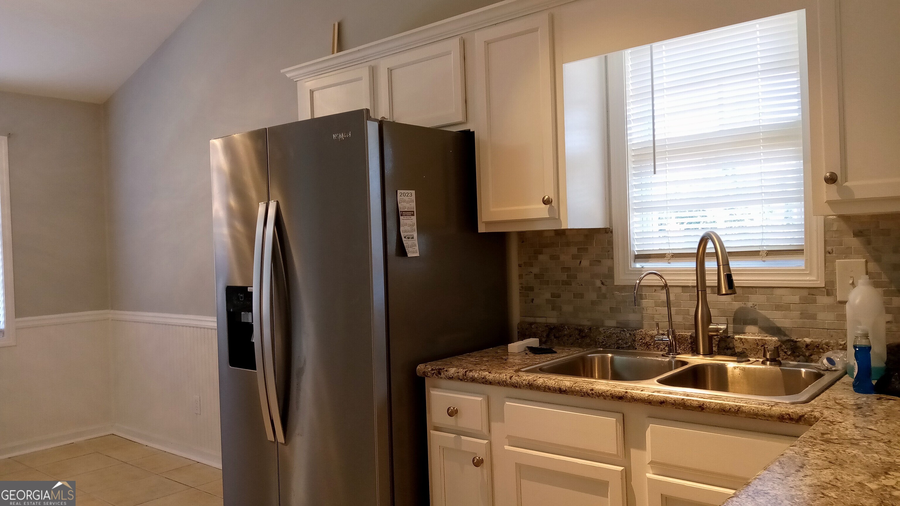907 Downing Drive Bethlehem, GA 30620 - Photo 14 of 26 a kitchen with refrigerator a sink and cabinets
