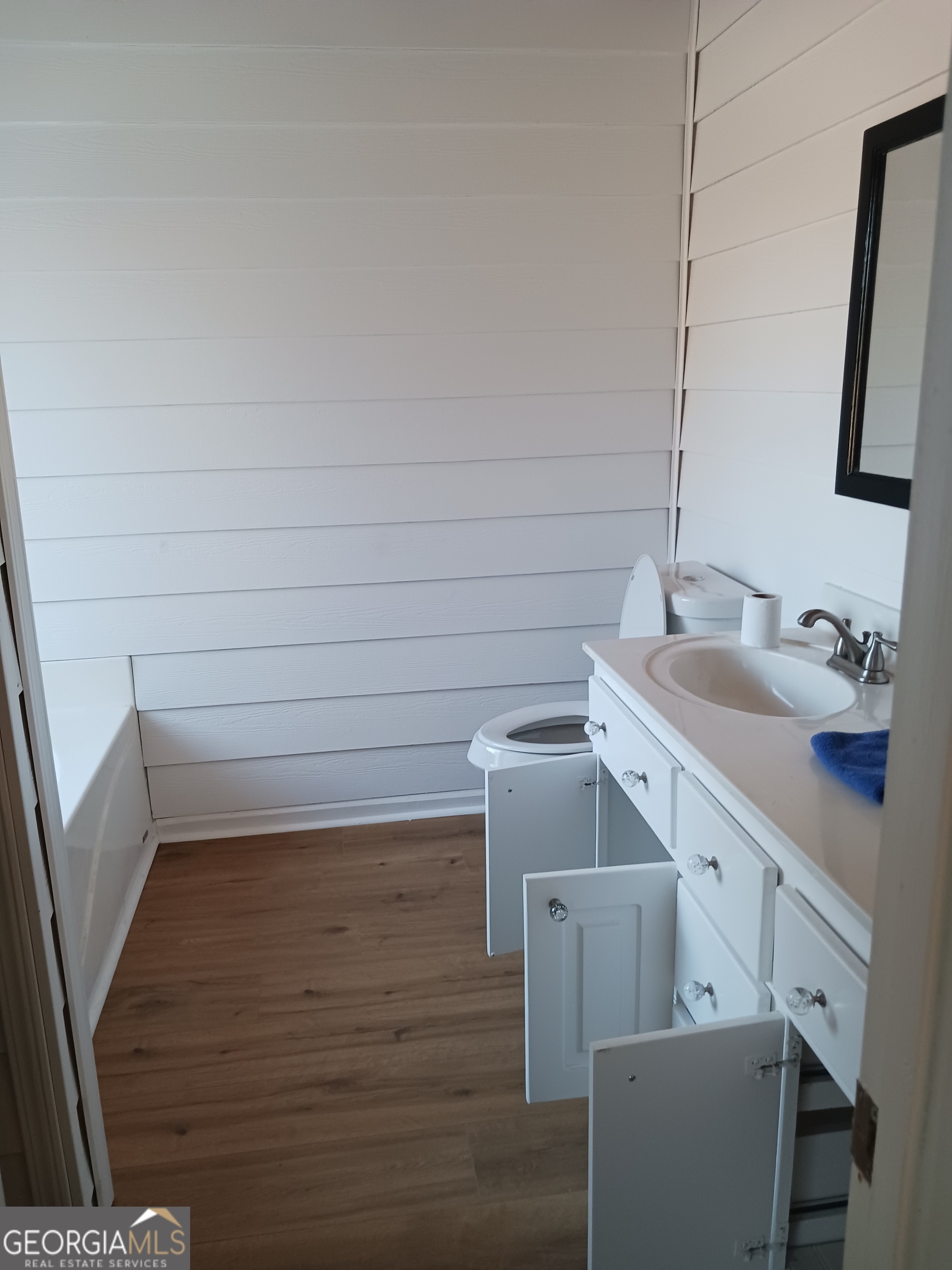 907 Downing Drive Bethlehem, GA 30620 - Photo 16 of 26 a bathroom with a sink and a mirror