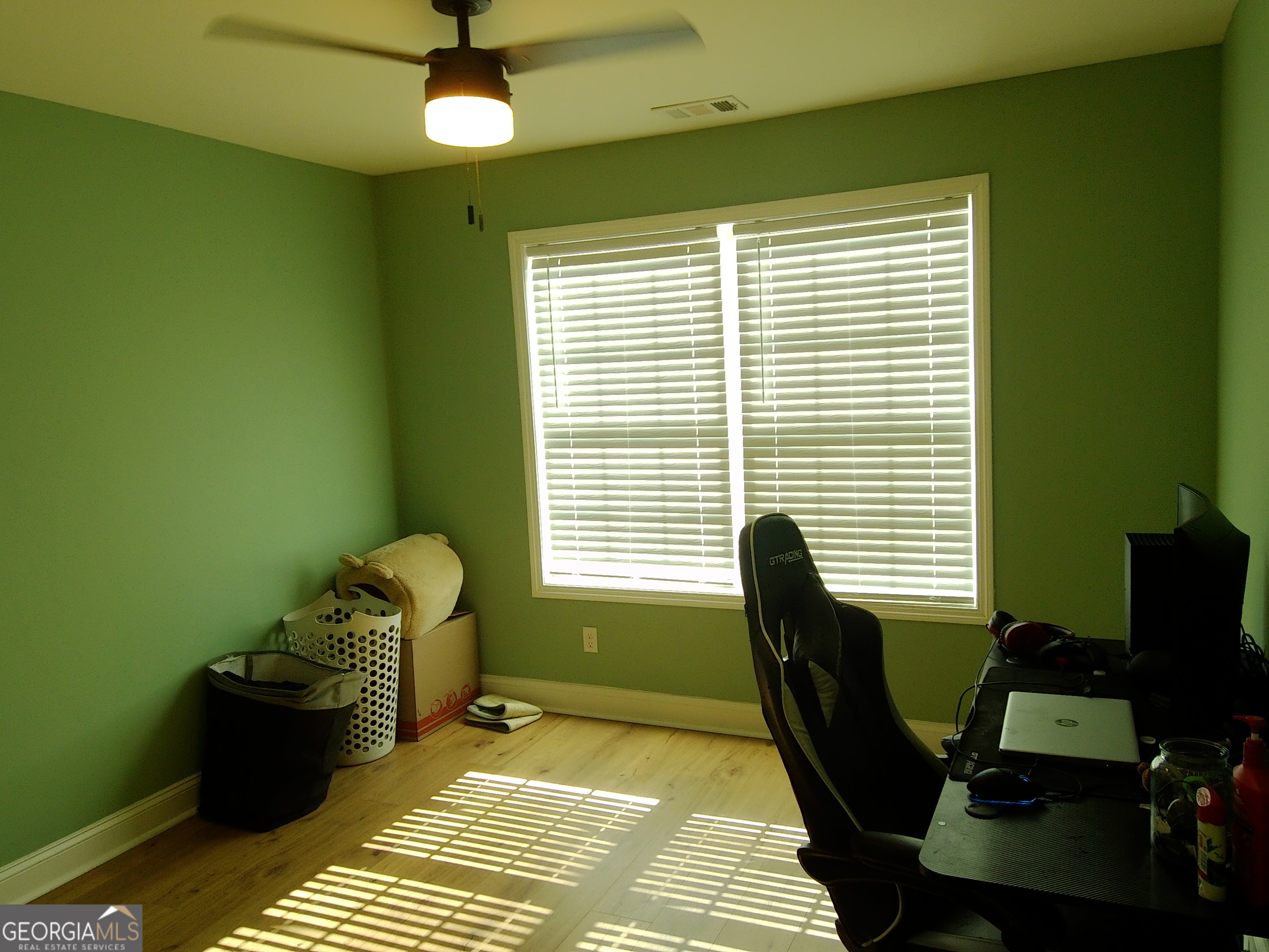 907 Downing Drive Bethlehem, GA 30620 - Photo 22 of 26 a view of a workspace with furniture and a window