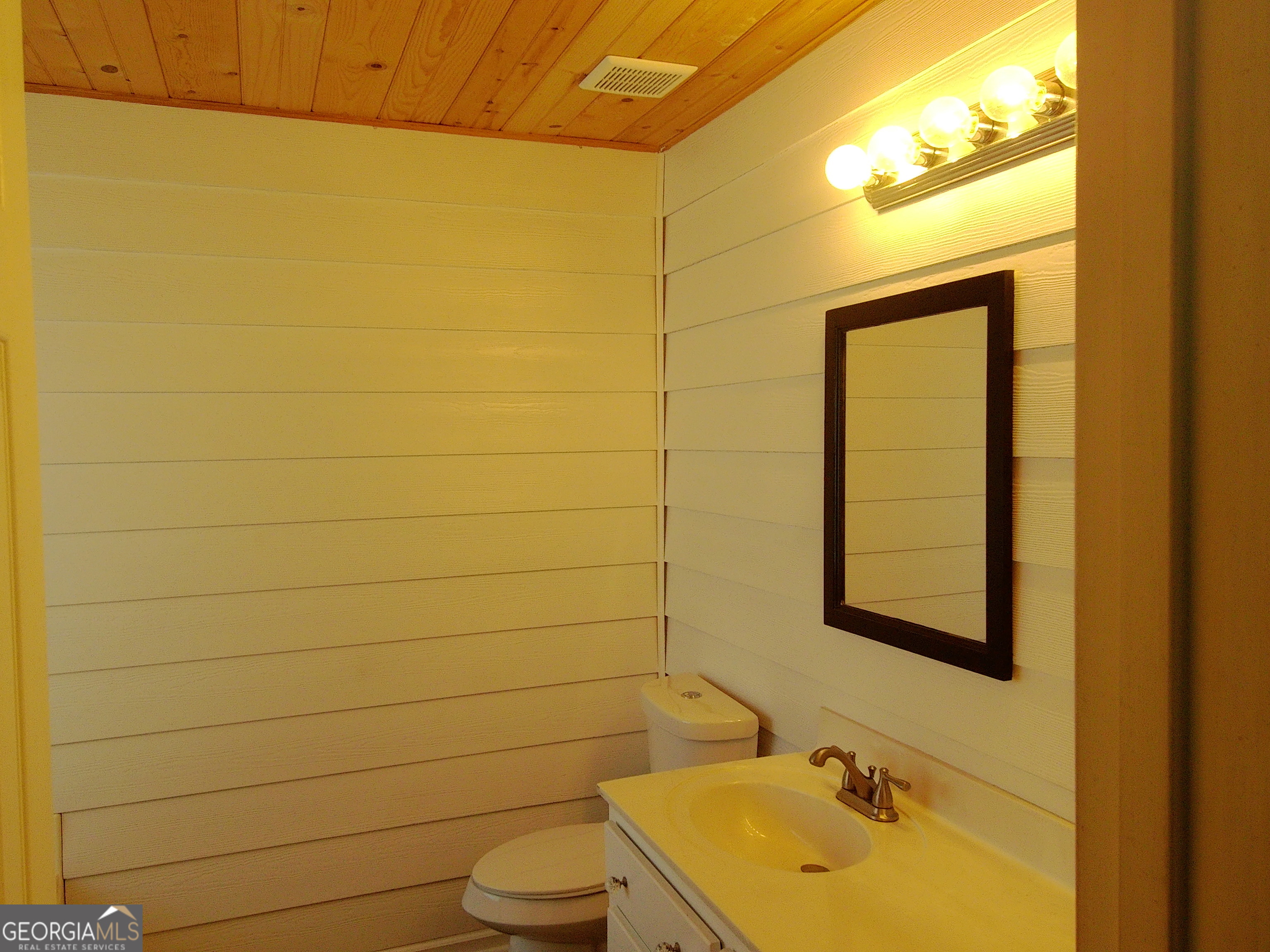 907 Downing Drive Bethlehem, GA 30620 - Photo 24 of 26 a bathroom with a sink toilet and shower