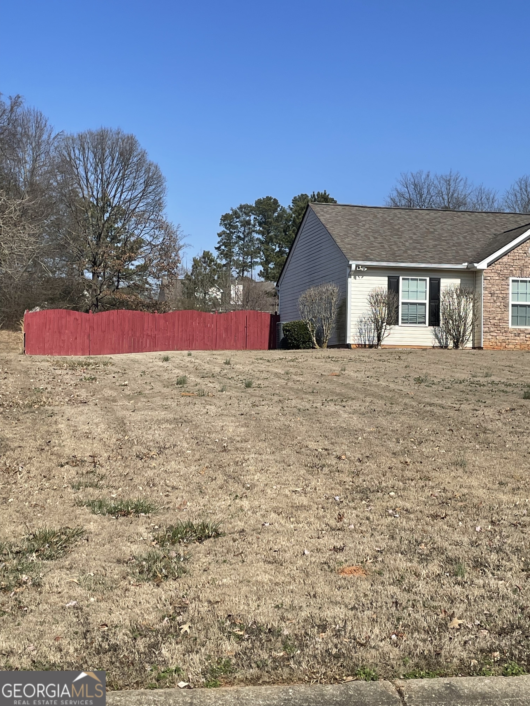 907 Downing Drive Bethlehem, GA 30620 - Photo 6 of 26 a view of a house with a yard