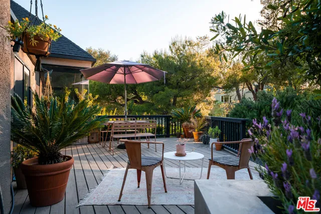 a view of a backyard with sitting area and furniture