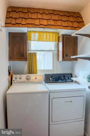 a bathroom with a double vanity sink and mirror