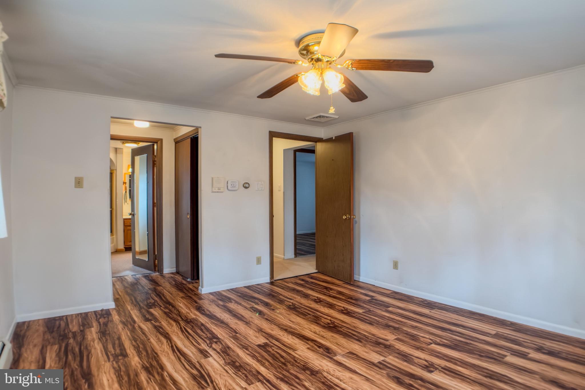 467 Swanger Road New Columbia, PA 17856 - Photo 29 of 45 a view of a room with wooden floor and a ceiling fan