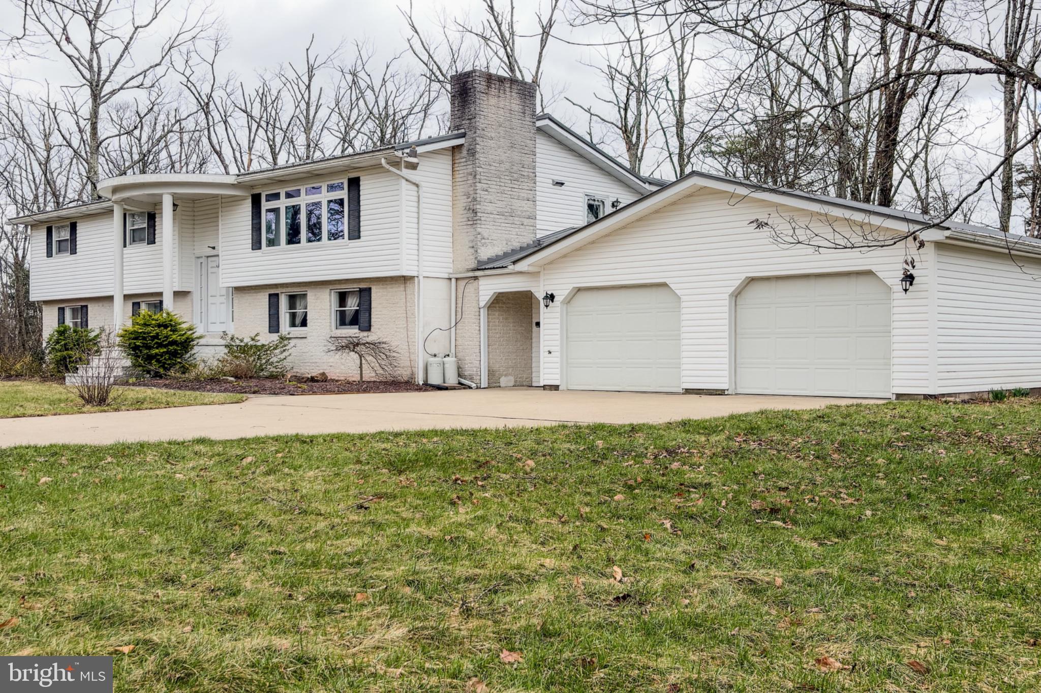 467 Swanger Road New Columbia, PA 17856 - Photo 38 of 45 a view of a white house next to a yard with big trees