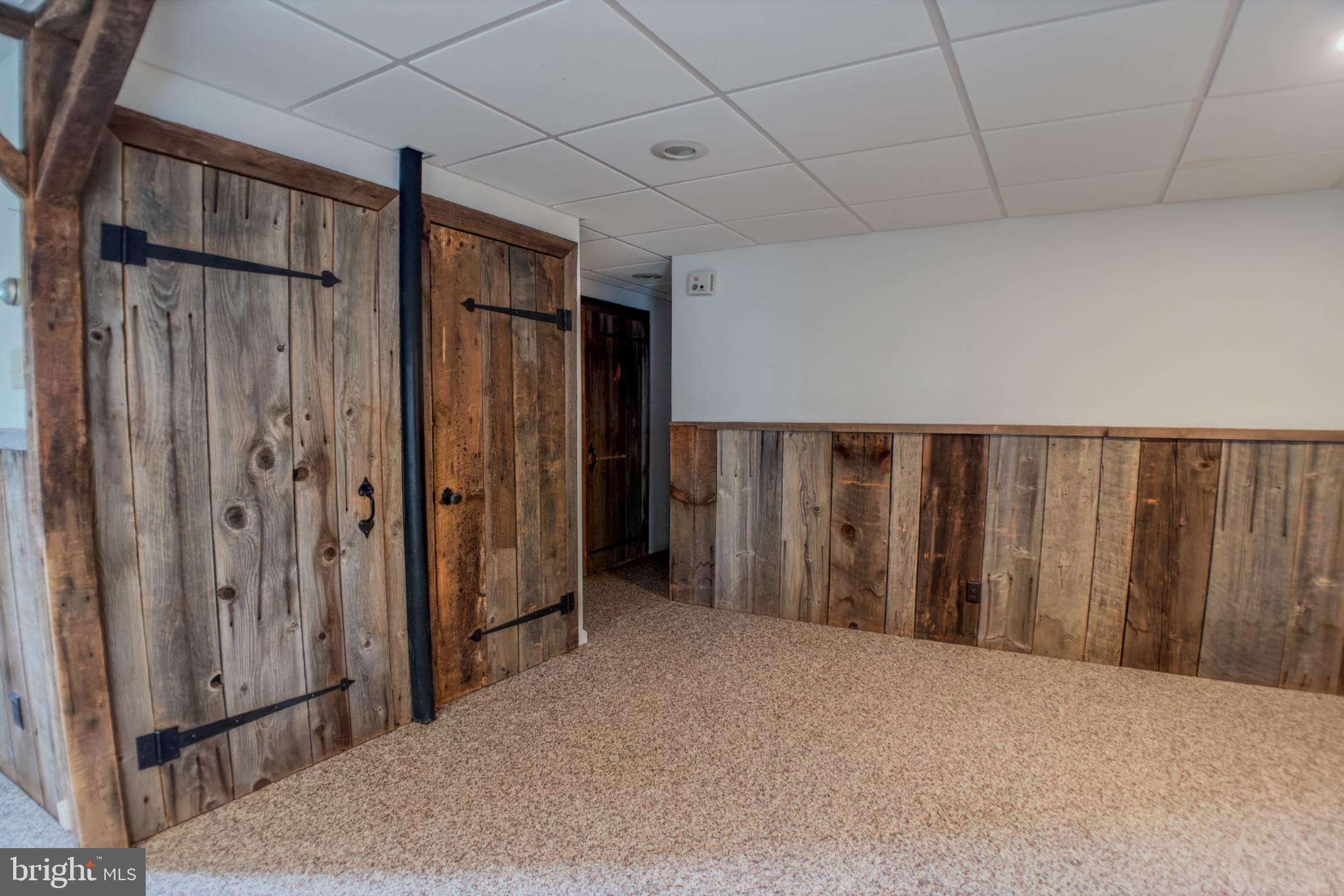 467 Swanger Road New Columbia, PA 17856 - Photo 10 of 45 a view of a utility room with wooden walls