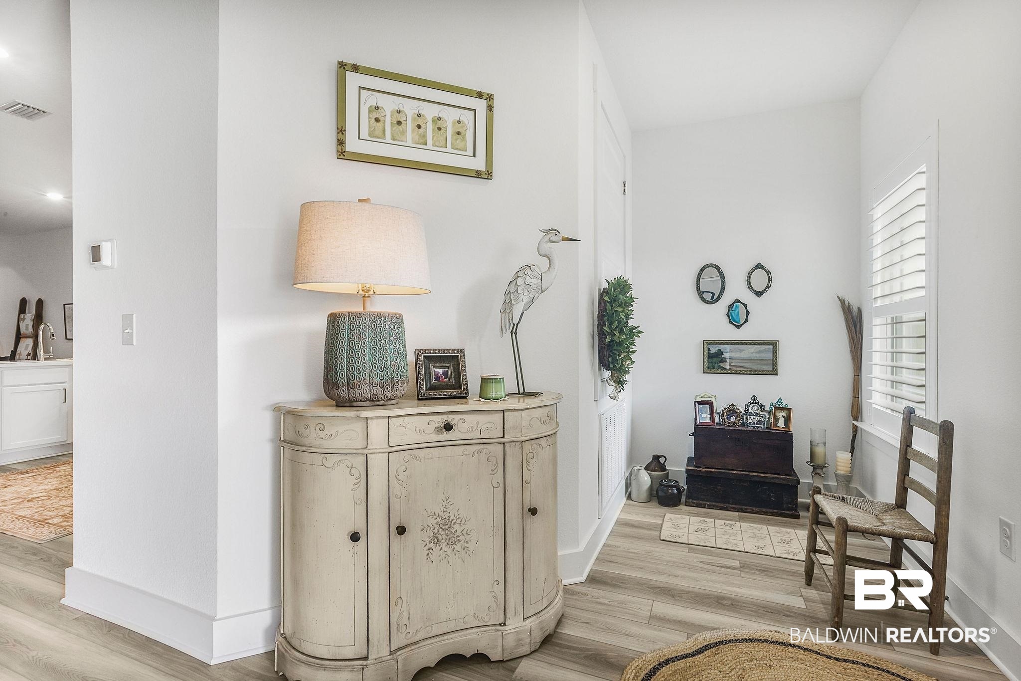 9901 Weller Cove Foley, AL 36535 - Photo 7 of 23 Hallway featuring light wood-style flooring and baseboards