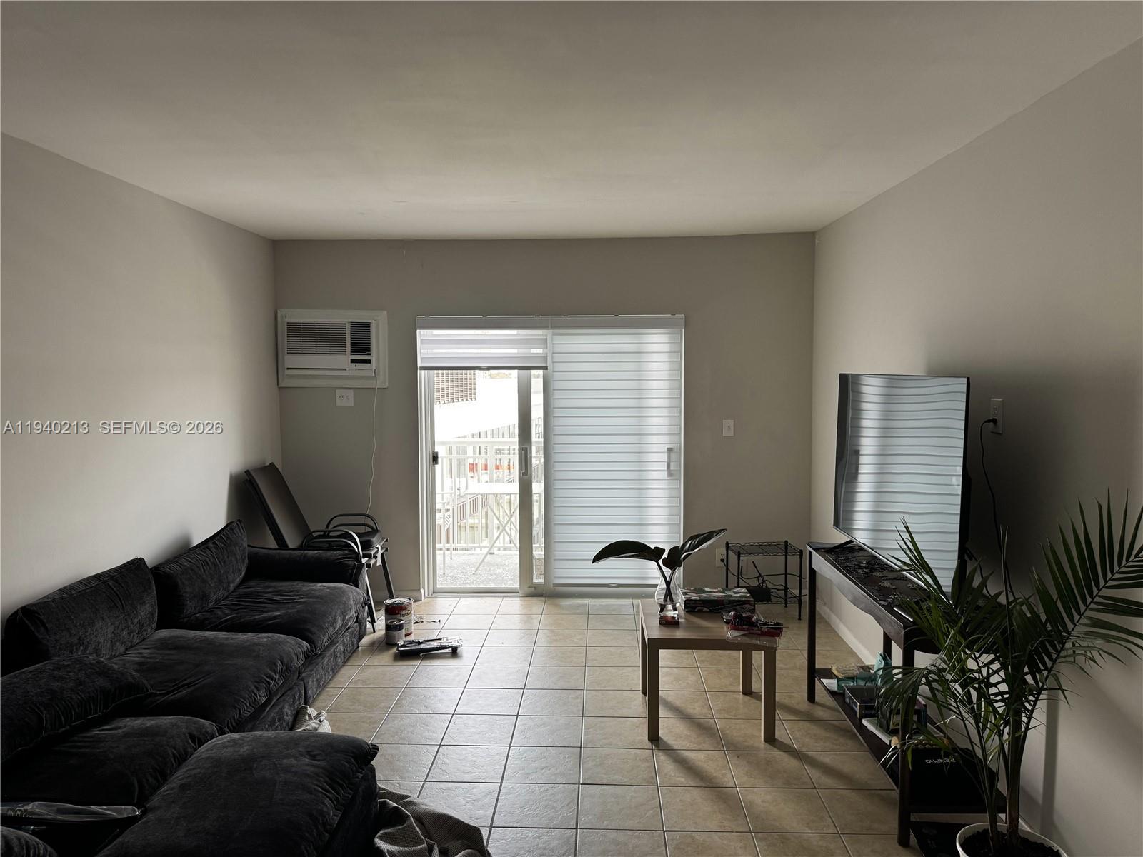 200 South Birch Road, Unit 702 Fort Lauderdale, FL 33316 - Photo 15 of 19 a living room with furniture and a window
