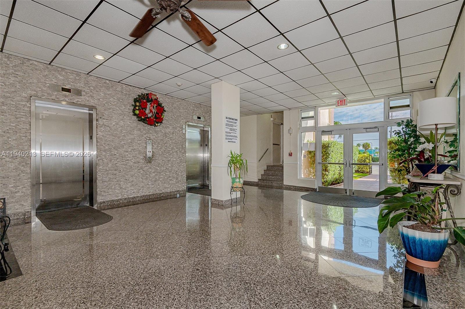 200 South Birch Road, Unit 702 Fort Lauderdale, FL 33316 - Photo 5 of 19 a lobby with furniture and potted plants