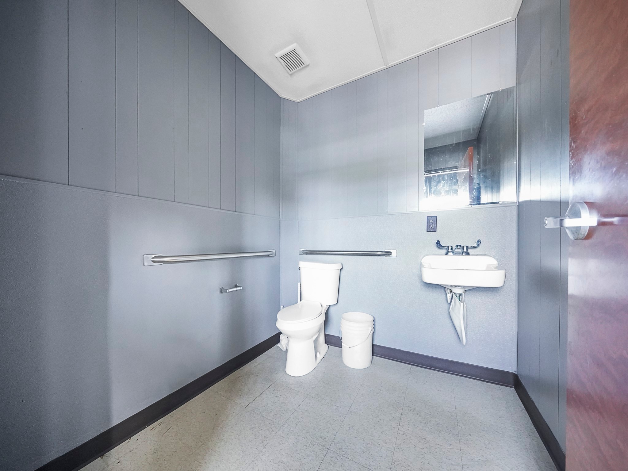 803 North Loop Houston, TX 77022 - Photo 11 of 16 a bathroom with a sink mirror and toilet