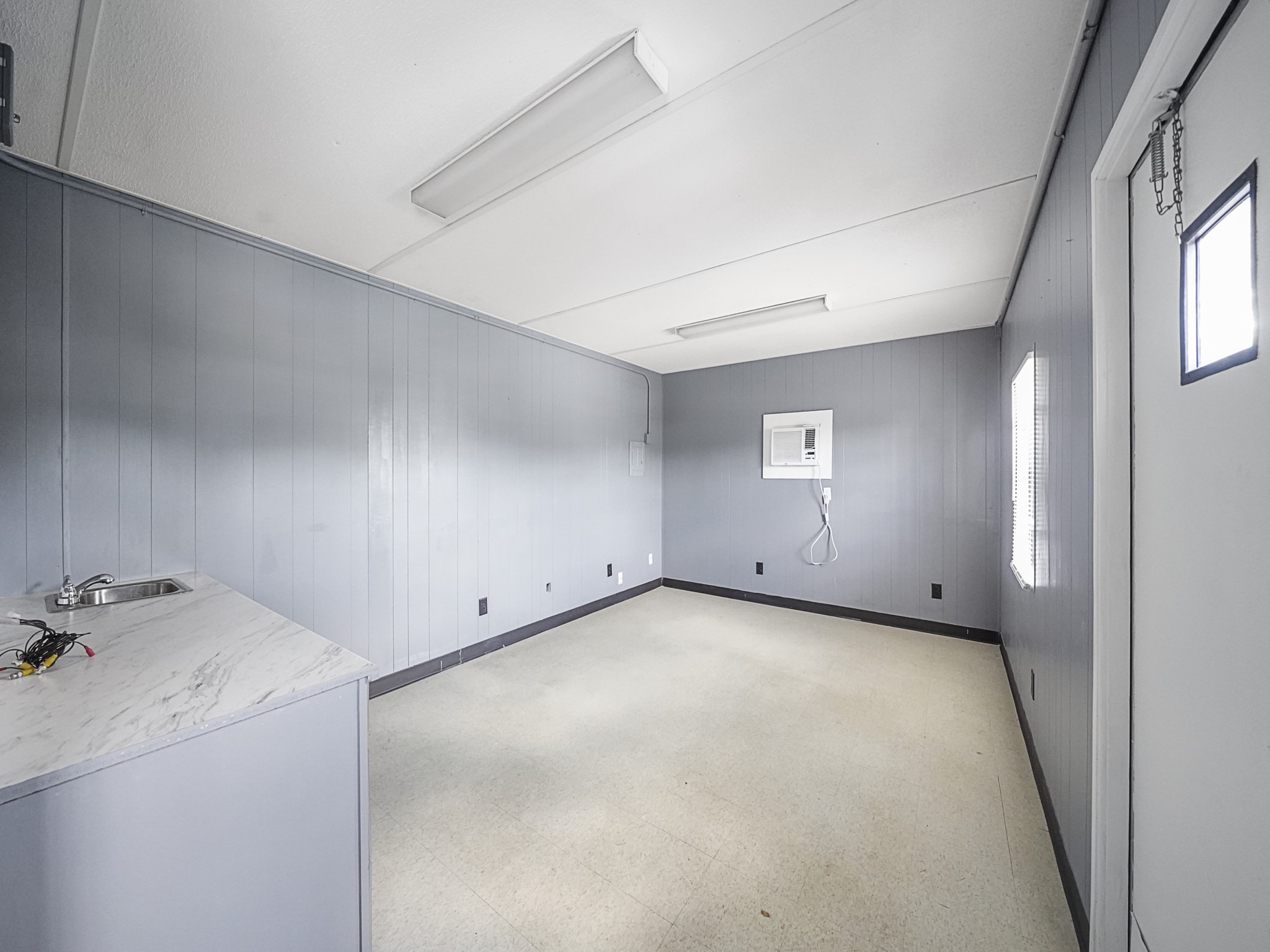 803 North Loop Houston, TX 77022 - Photo 12 of 16 a view of a room with a sink and cabinets