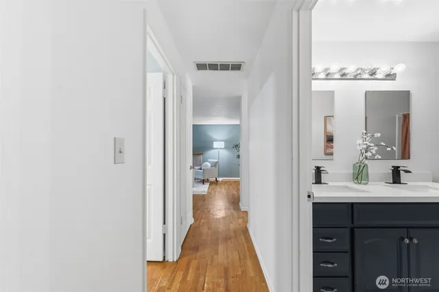 a en suite bathroom with a sink and a mirror