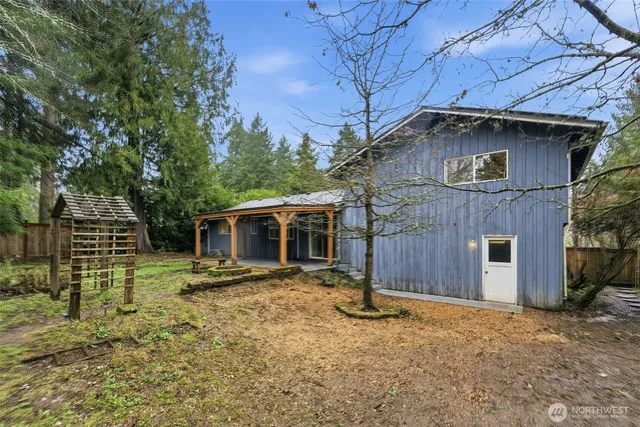 a house with trees in the background