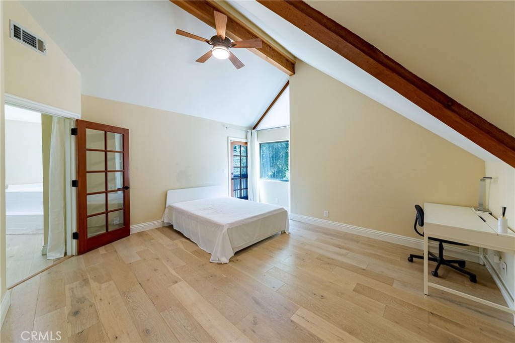 15601 Saddleback Road Canyon Country, CA 91387 - Photo 23 of 55 a view of an empty room with a window and wooden floor