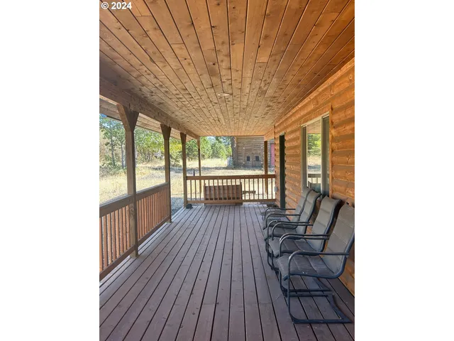 a view of a patio with wooden floor