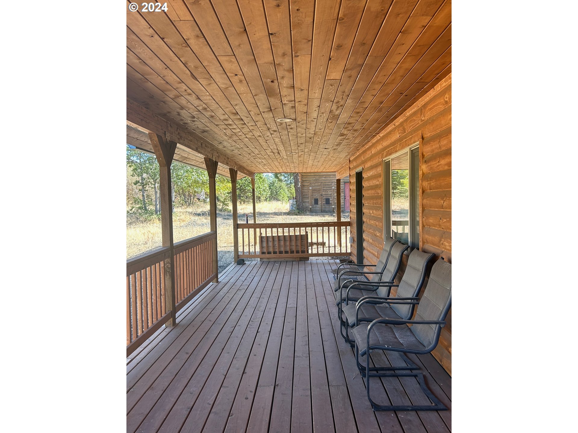 211 Jensen Quarry Road Roosevelt, WA 99356 - Photo 13 of 27 a view of a patio with wooden floor