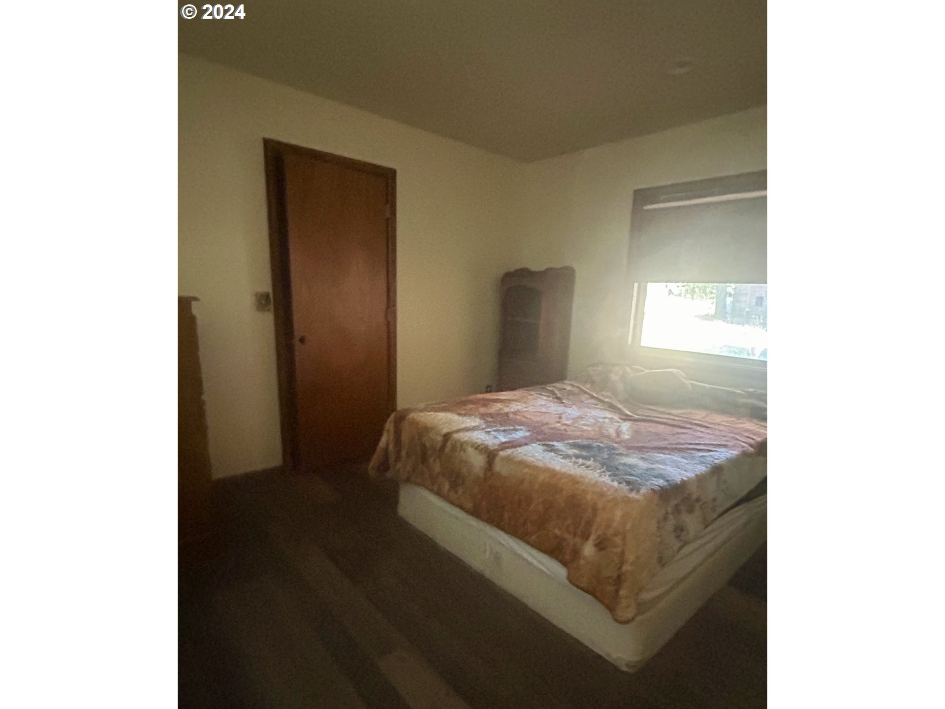 211 Jensen Quarry Road Roosevelt, WA 99356 - Photo 16 of 27 a bedroom with a bed and a window