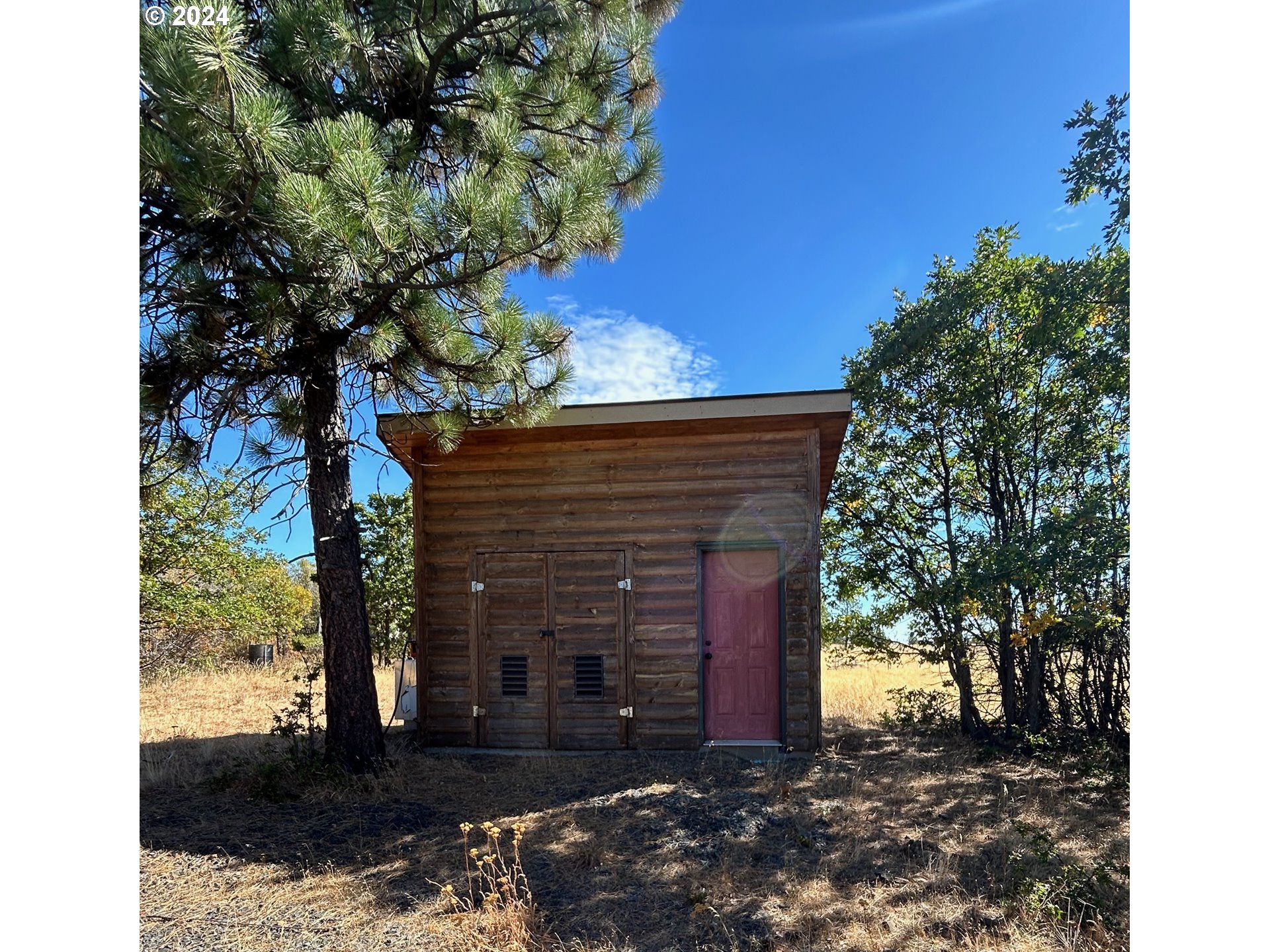 211 Jensen Quarry Road Roosevelt, WA 99356 - Photo 6 of 27 a front view of a house with a yard
