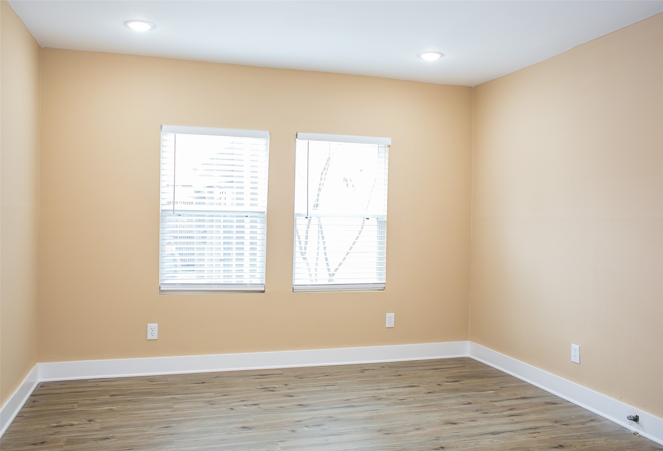 2301 Albans Road Houston, TX 77005 - Photo 11 of 17 a view of an empty room with wooden floor and a window