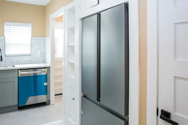 a bathroom with a double vanity sink and a mirror