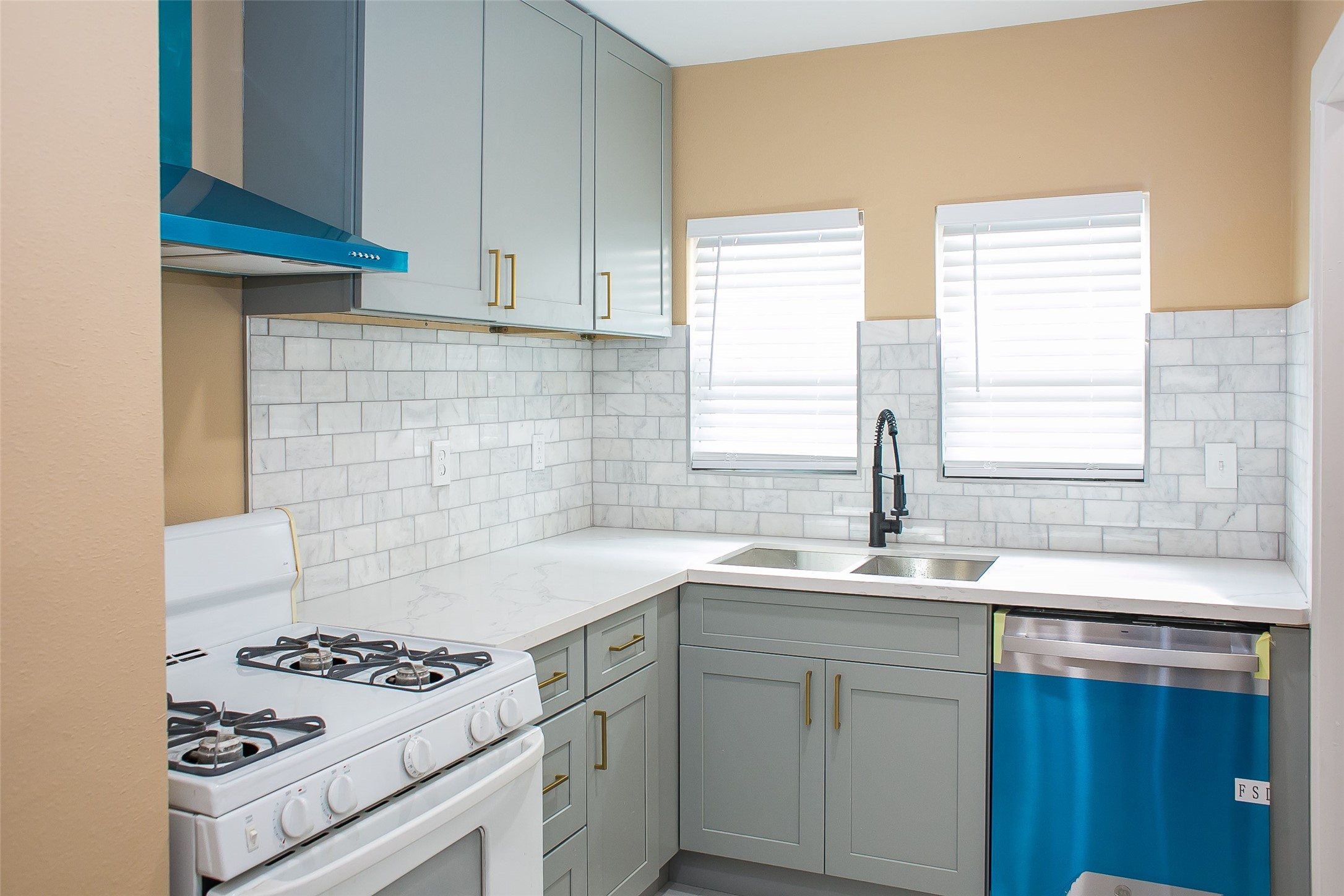 2301 Albans Road Houston, TX 77005 - Photo 14 of 17 a kitchen with granite countertop a sink stove and cabinets