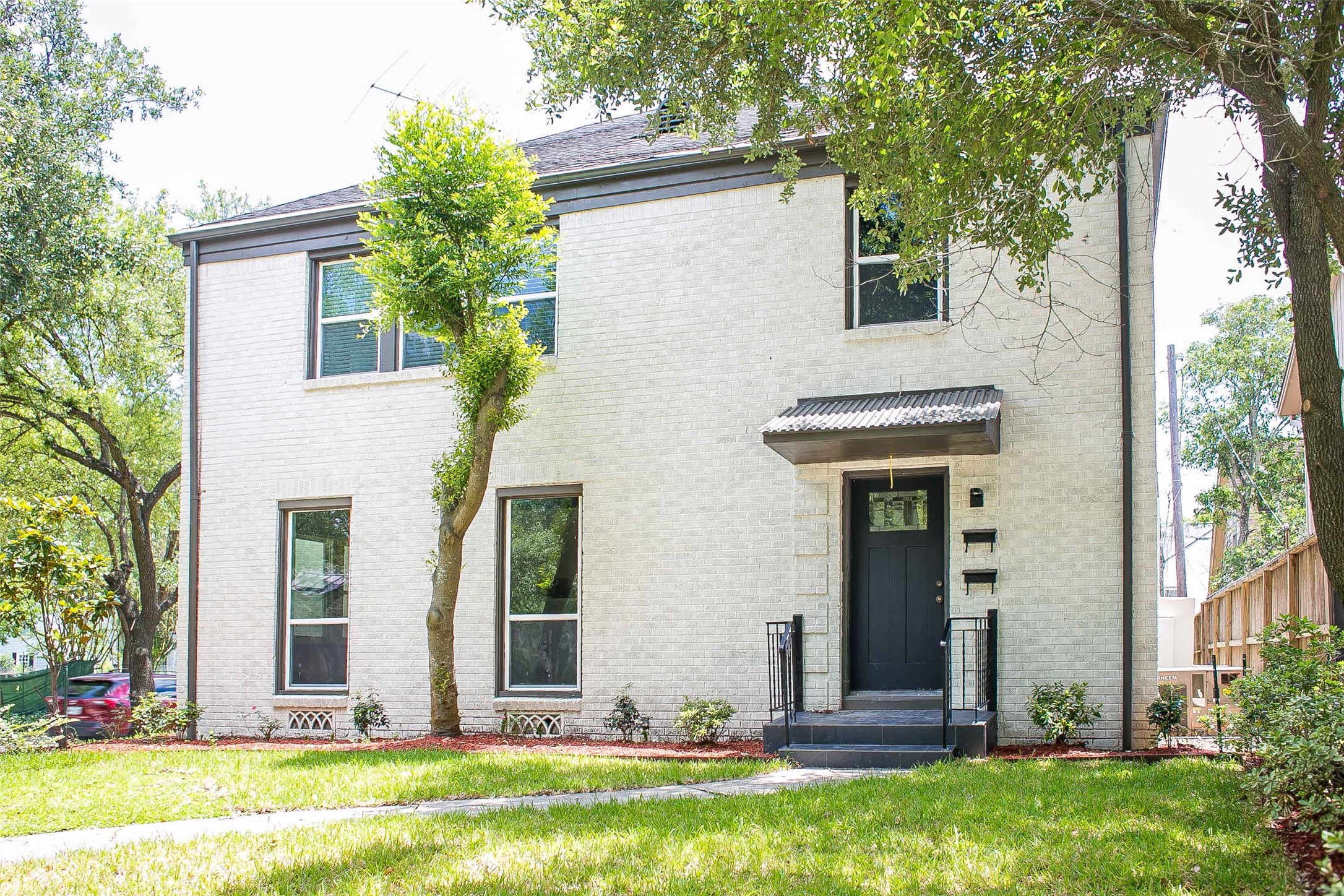 2301 Albans Road Houston, TX 77005 - Photo 3 of 17 a view of a house with backyard and garden