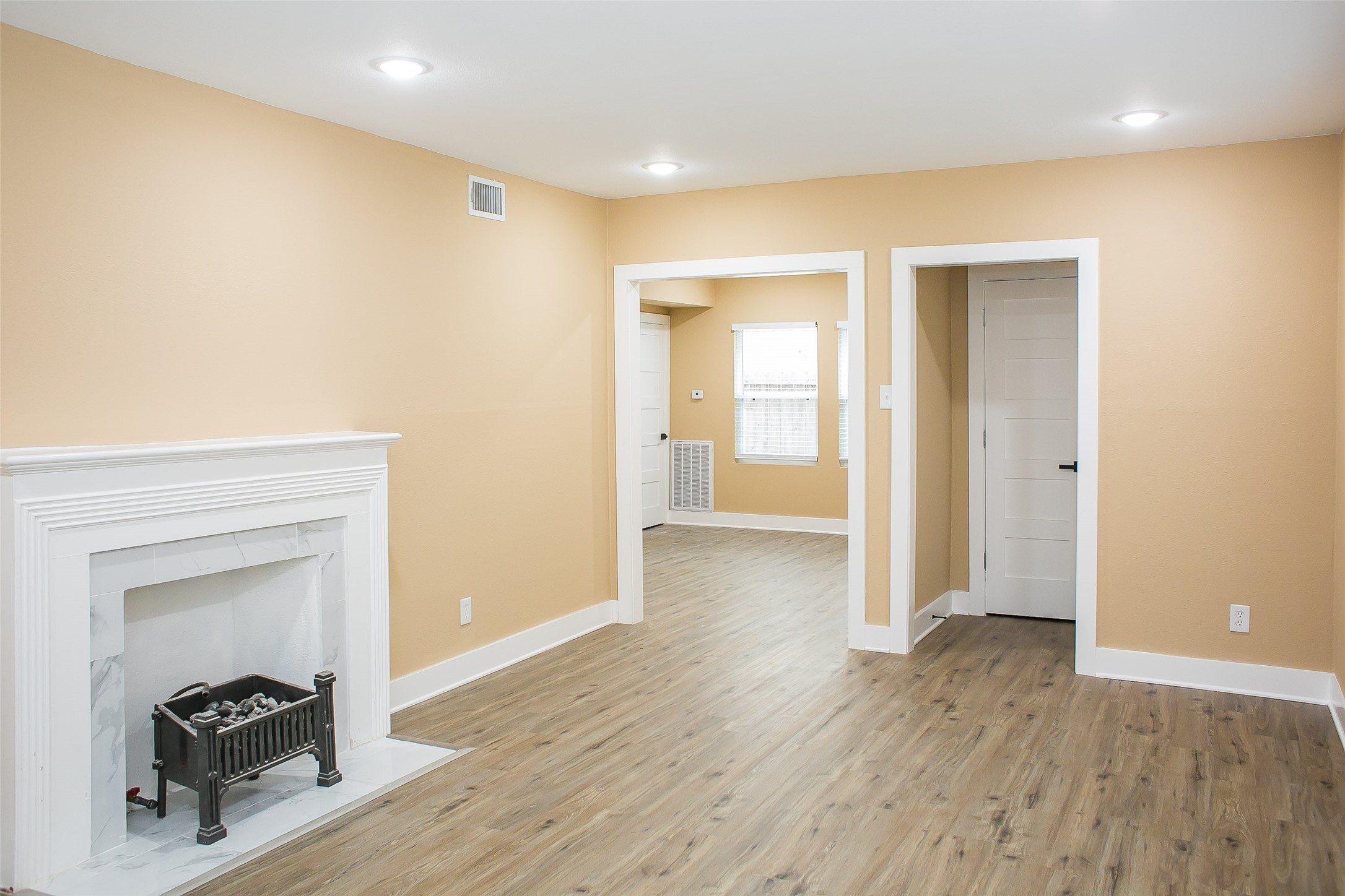 2301 Albans Road Houston, TX 77005 - Photo 4 of 17 a view of a hallway with wooden floor and a bathroom