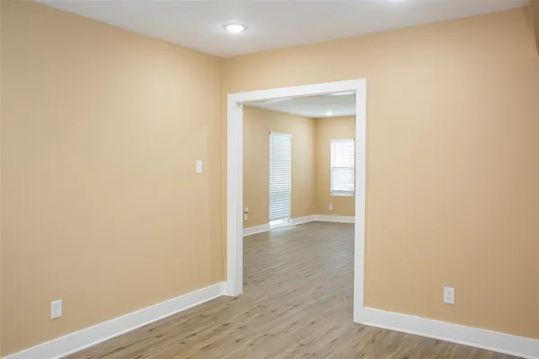 a view of a small space with wooden floor