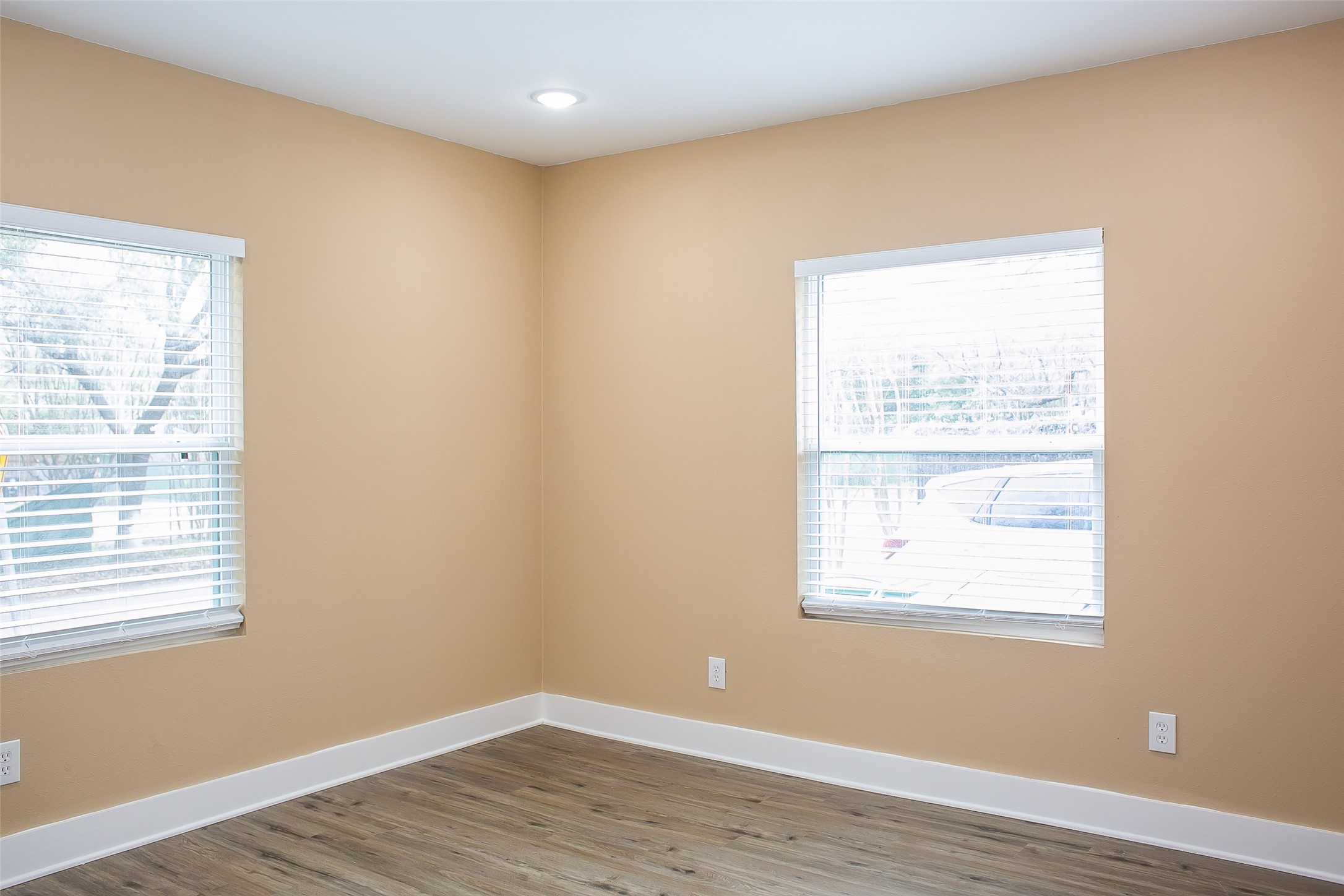 2301 Albans Road Houston, TX 77005 - Photo 10 of 17 a view of an empty room with wooden floor and a window