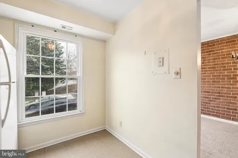 a view of empty room with windows