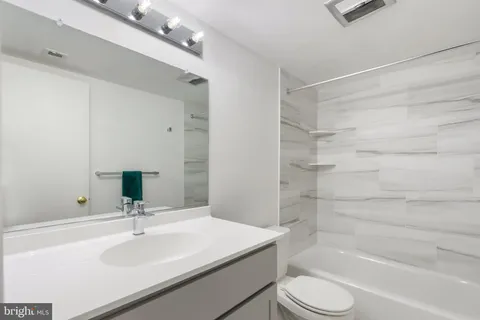 a view of balcony with wooden floor and fence